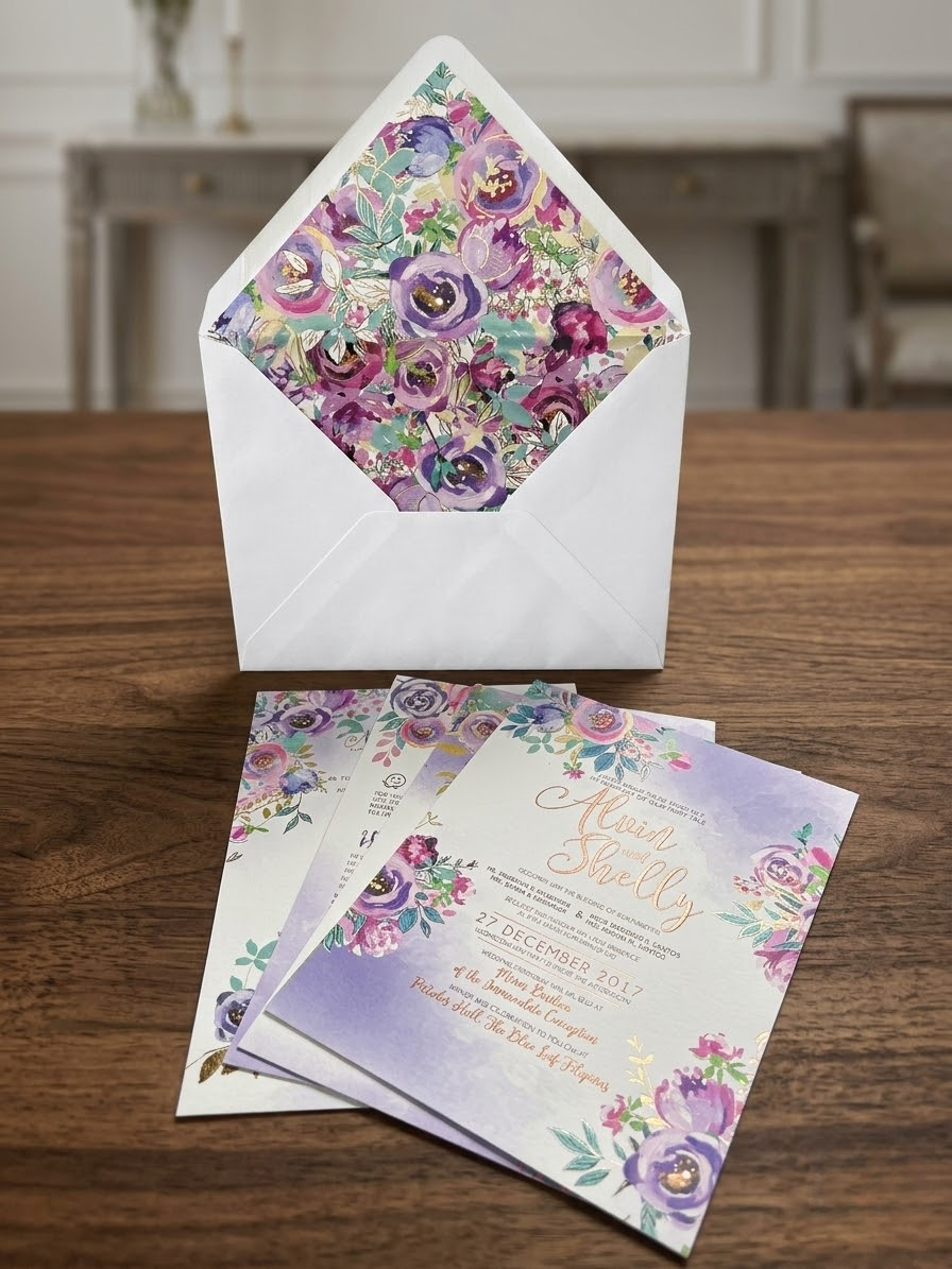 Foil stamped invitation – gold foil monogram on navy background