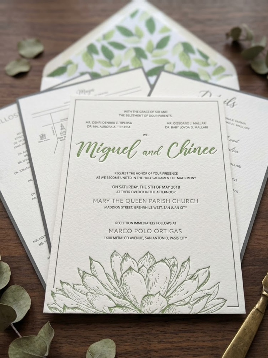 Letterpress invitation with satin ribbon belly band